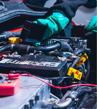 Technician working on battery and electrical components