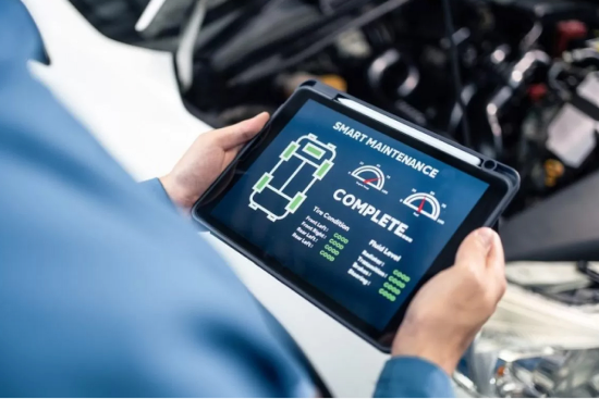 Technician running remote diagnostics on an EV battery pack